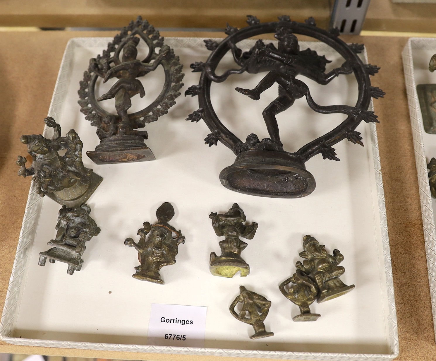 Assorted bronze and cast metal deities, largest 18 cms high